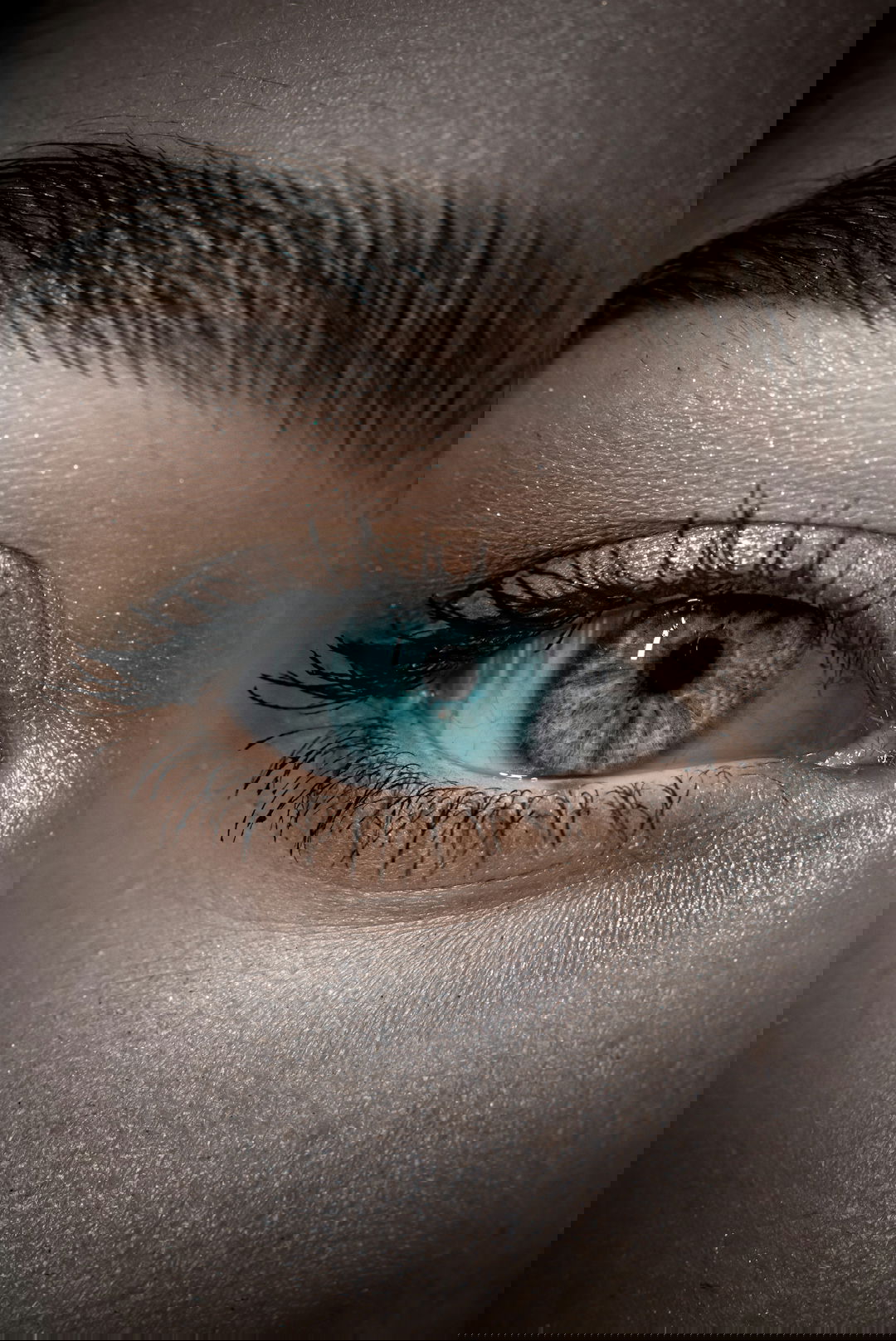 persons blue eyes in close up photography